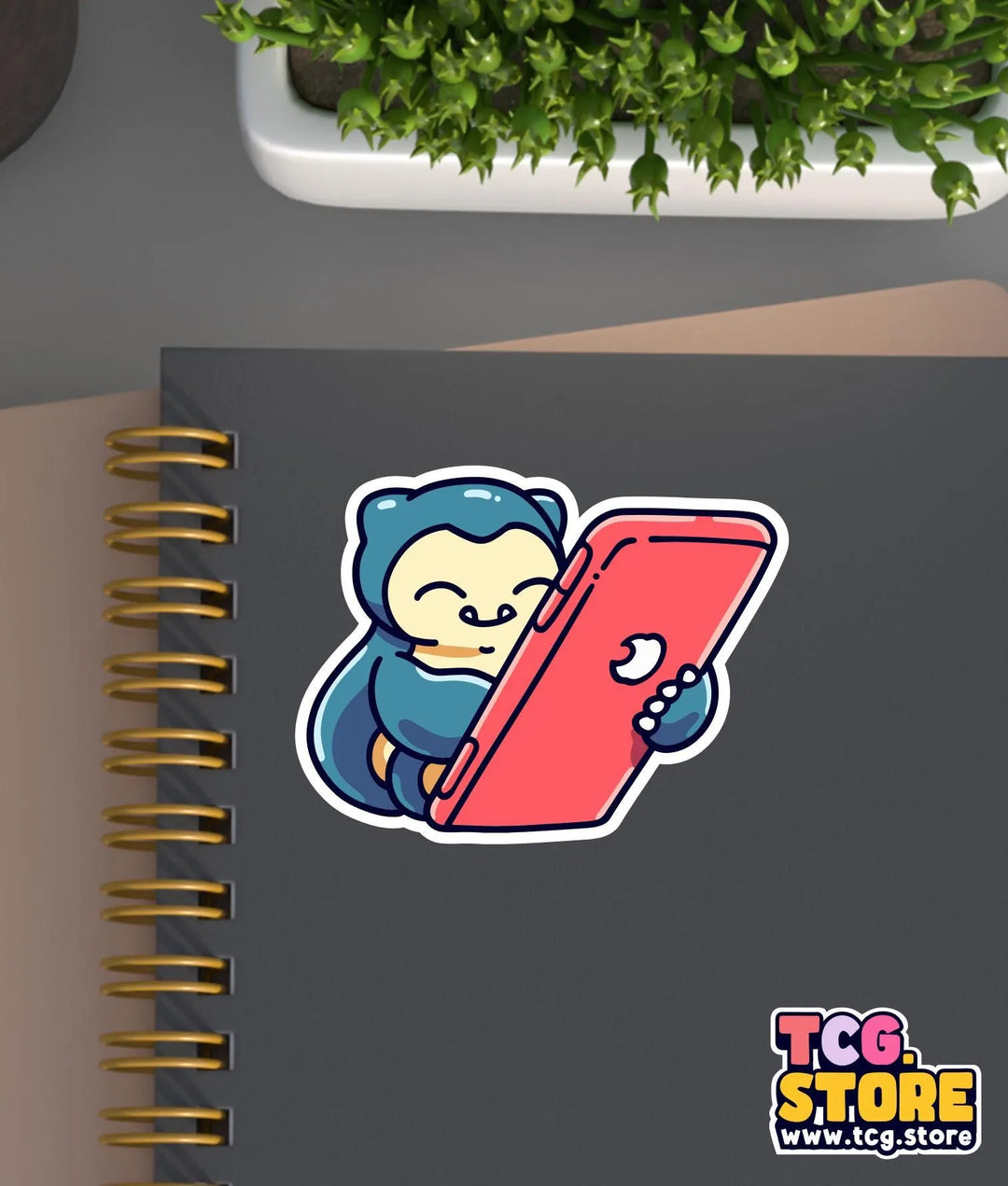 a notebook with a sticker of a person holding a tablet