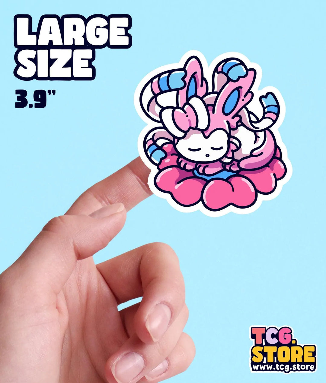 a hand holding a sticker of a pink bunny