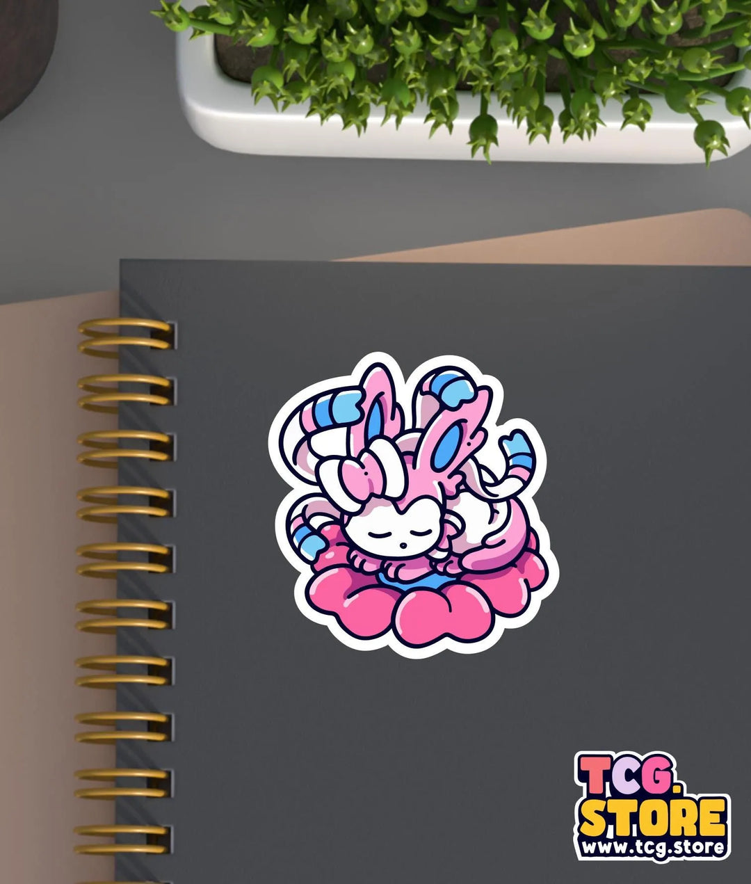 a notebook with a sticker of a rabbit holding a flower