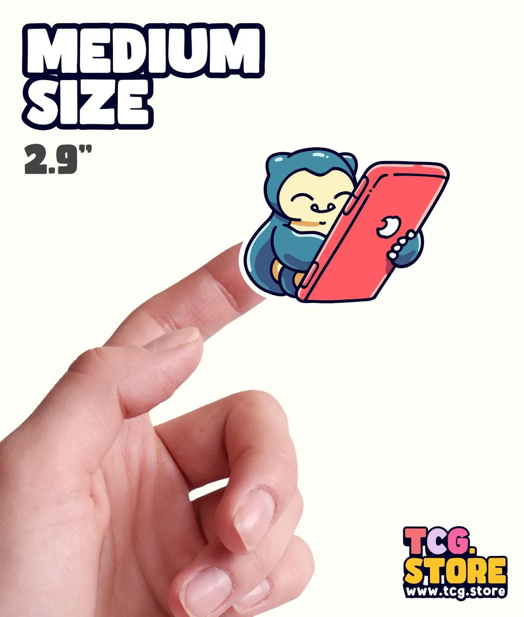 a hand holding a small sticker with a monkey on it