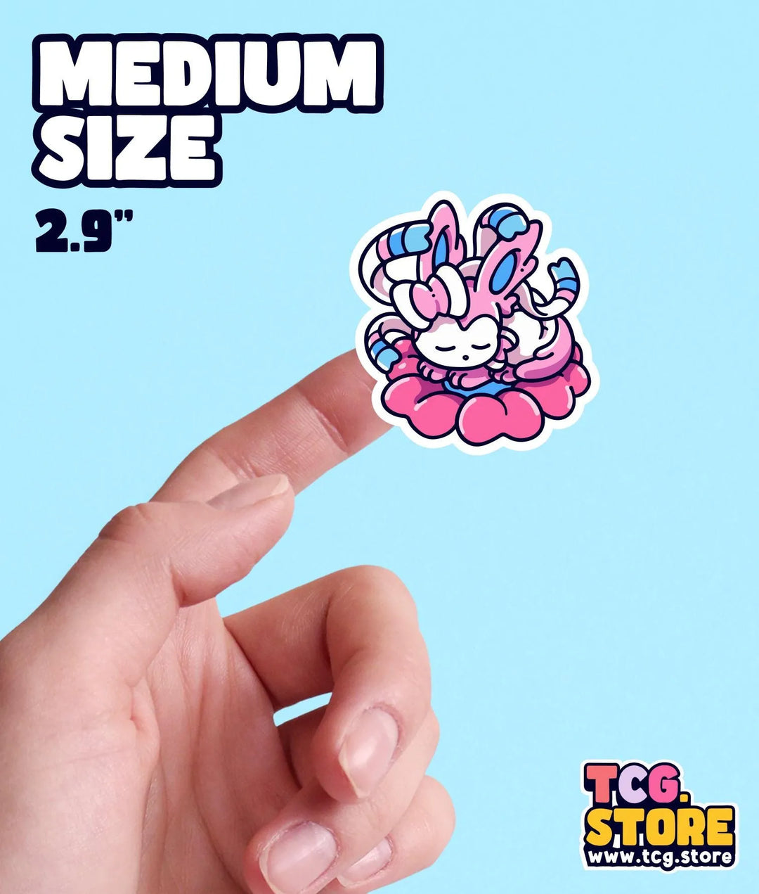 a hand holding a small sticker with a bunny on it