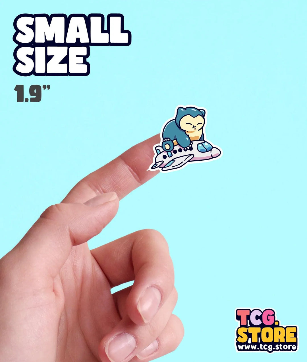 a hand holding a small sticker of a monkey on a skateboard