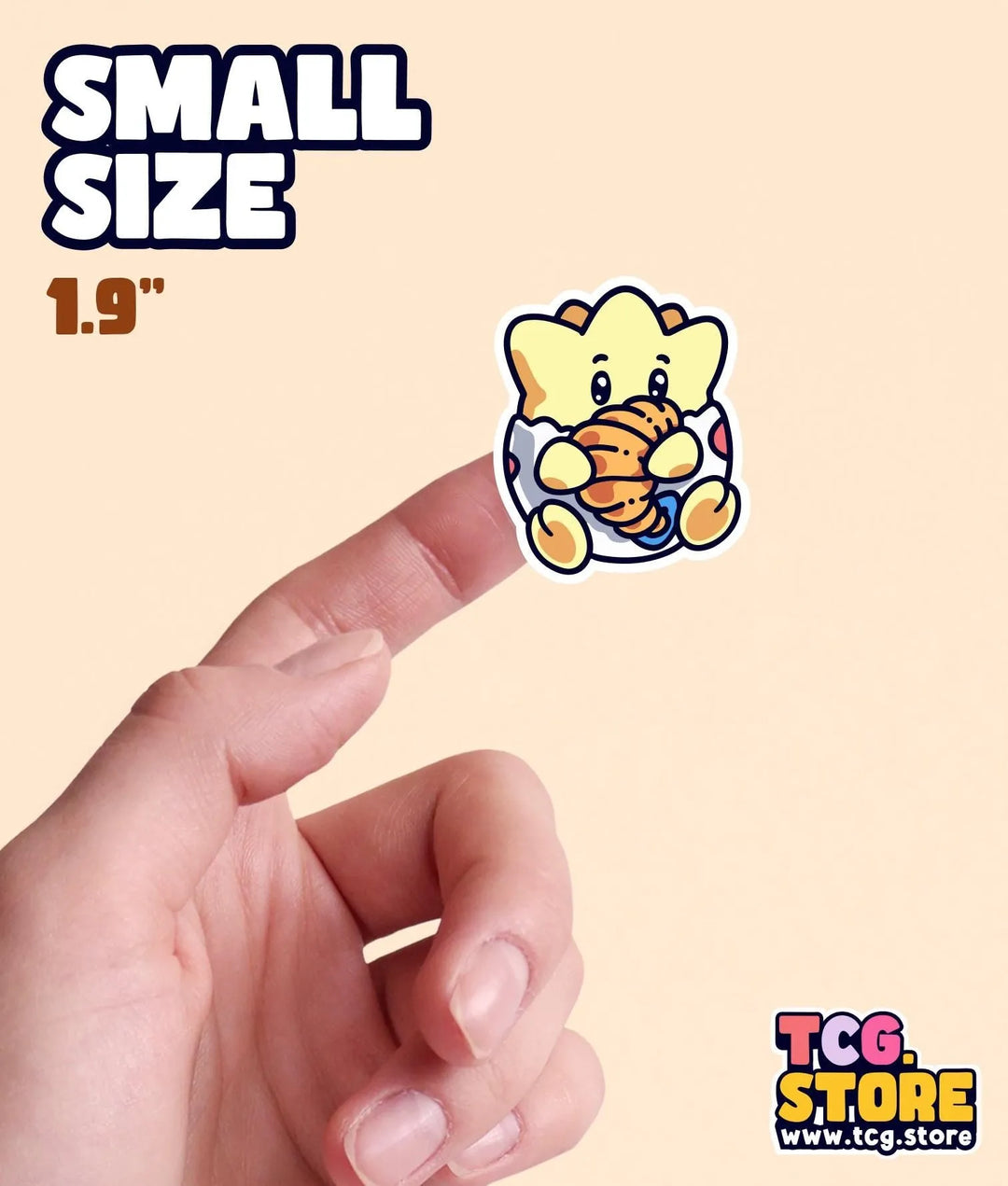 a hand is pointing at a small sticker
