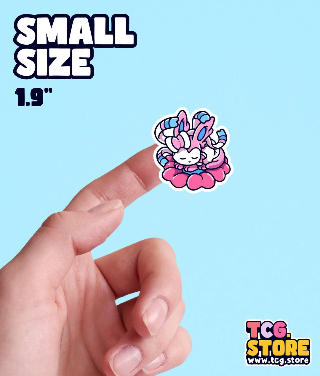 a hand is pointing at a small sticker