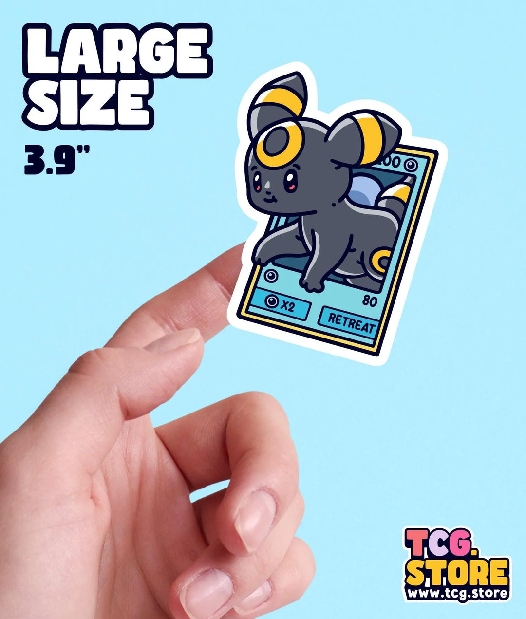 a hand holding a small sticker of a mouse