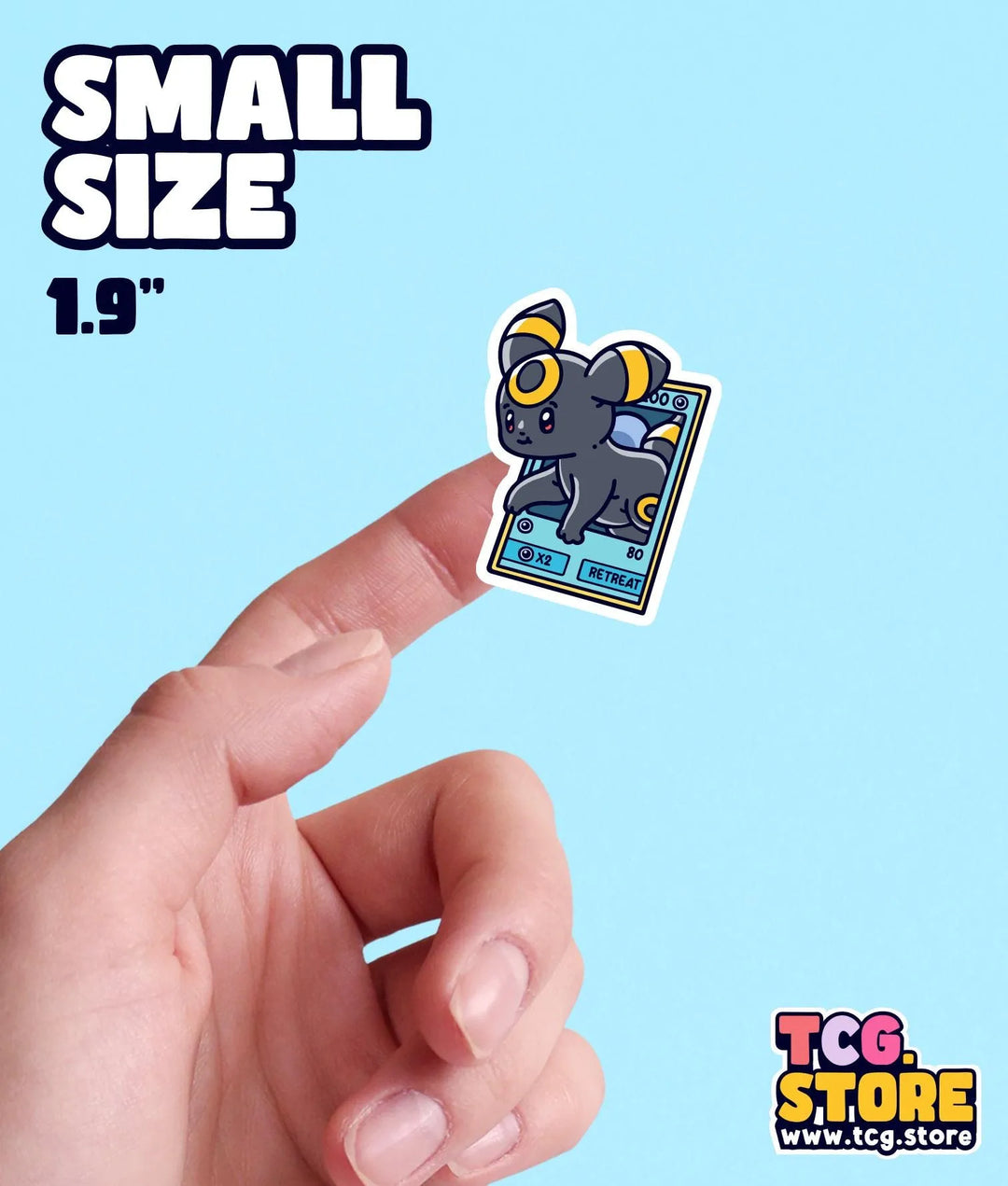 a hand holding a small sticker of a small animal
