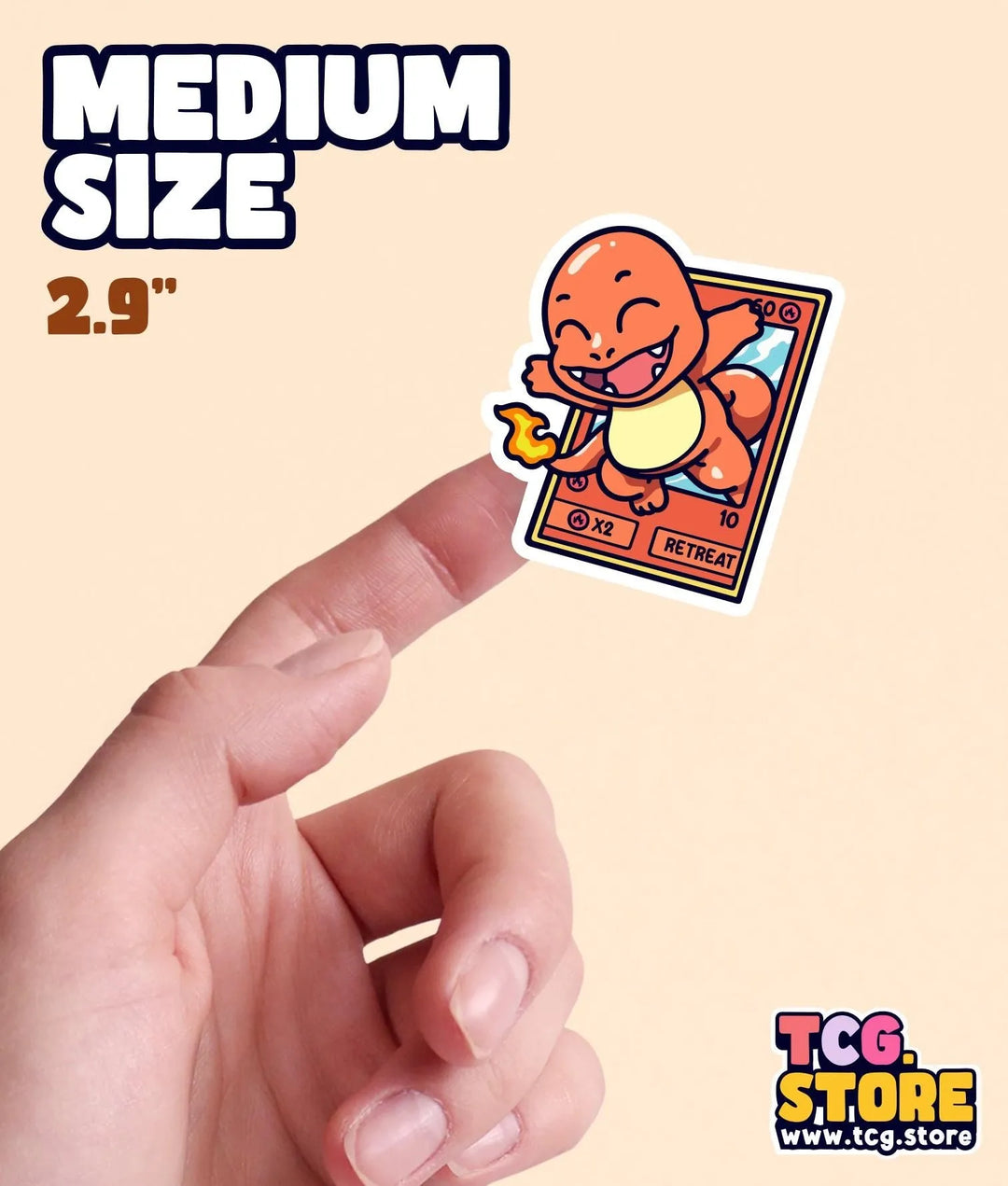 a hand holding a small sticker of a cartoon character
