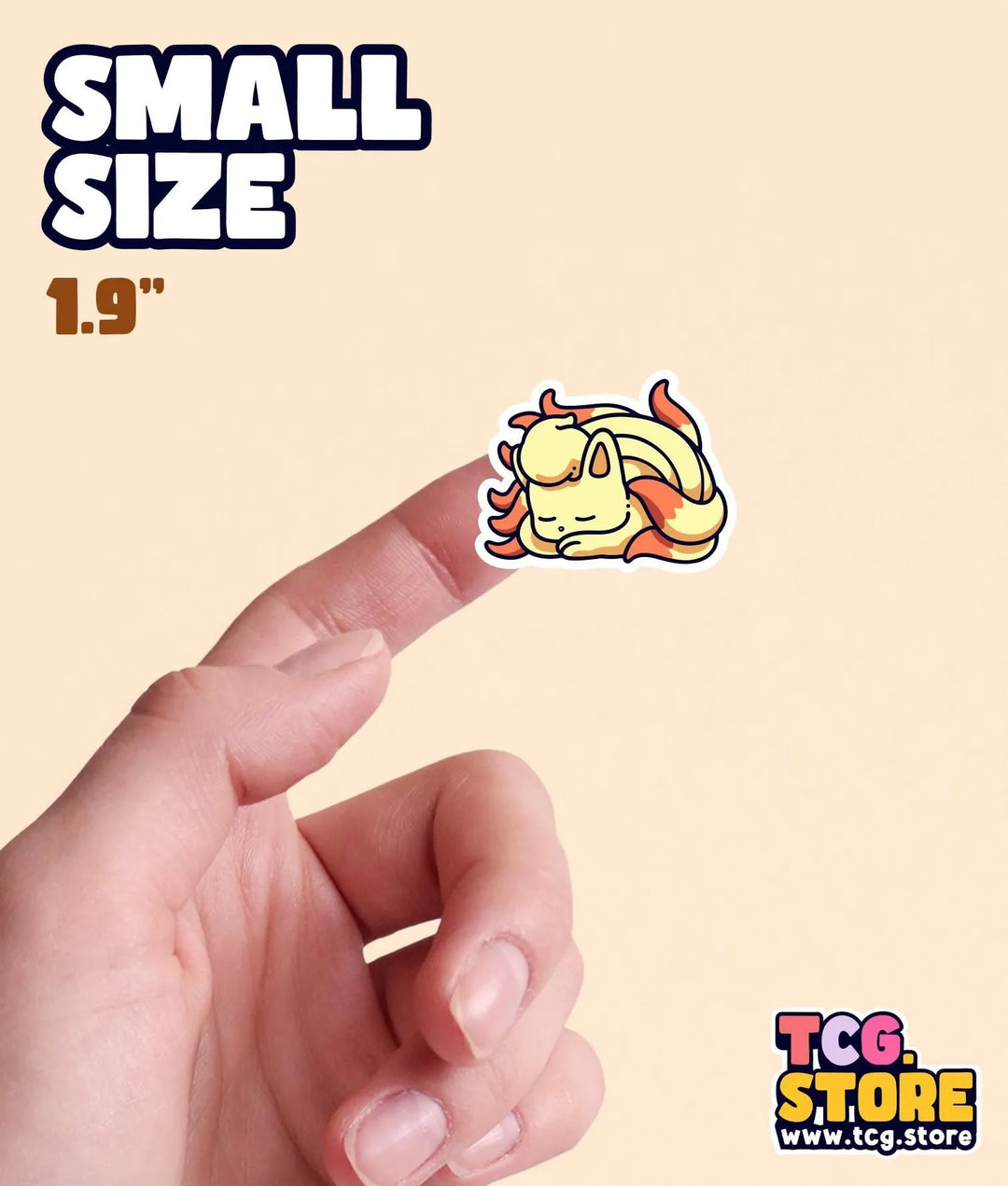 a hand holding a small sticker of a dog