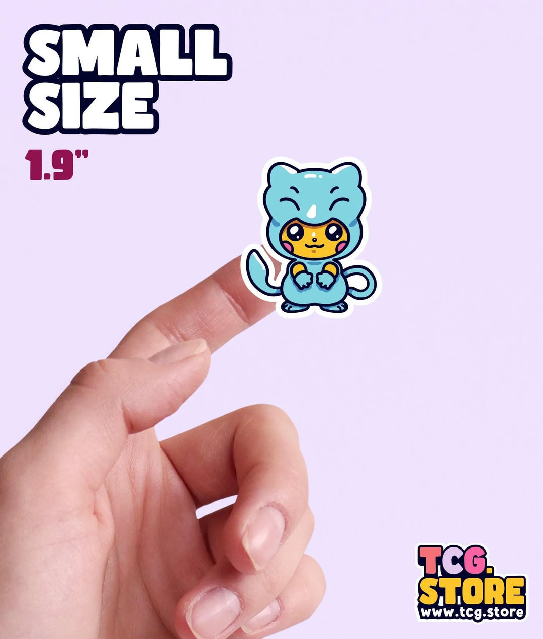 a hand holding a small sticker of a blue bear