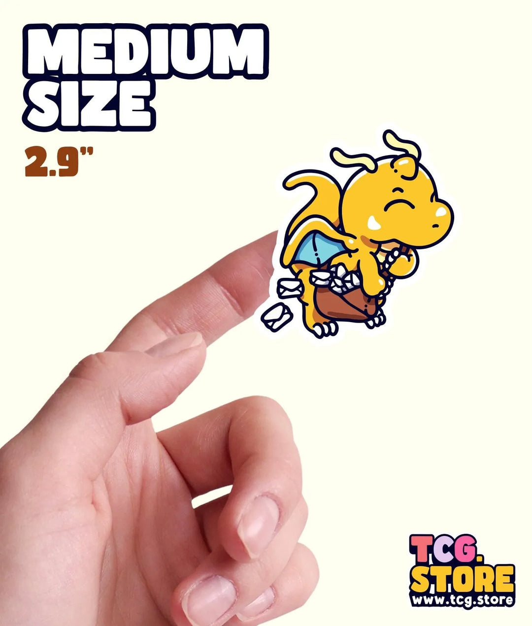 a hand holding a small sticker of a dog