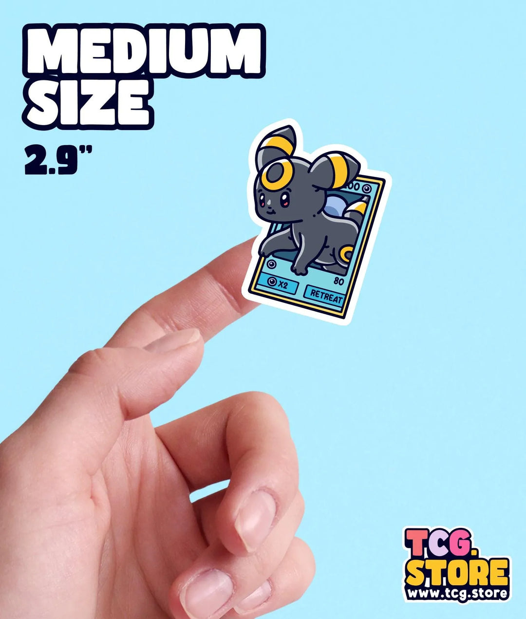 a hand holding a small sticker of a mouse