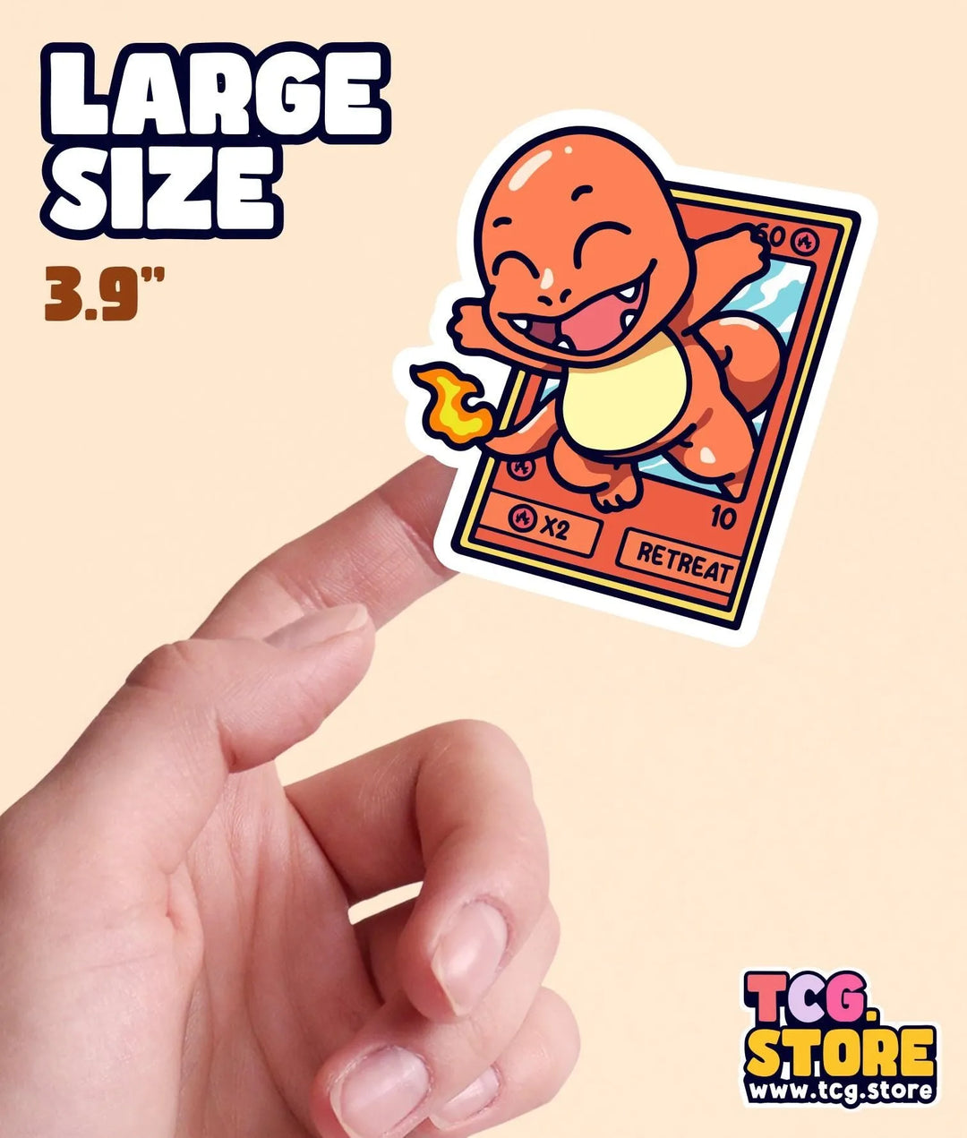 a hand holding a small sticker of a cat