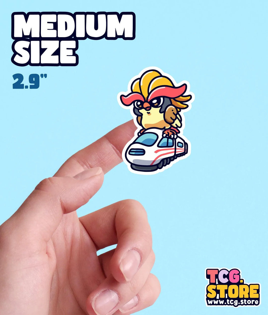 a hand holding a small sticker of a cartoon character