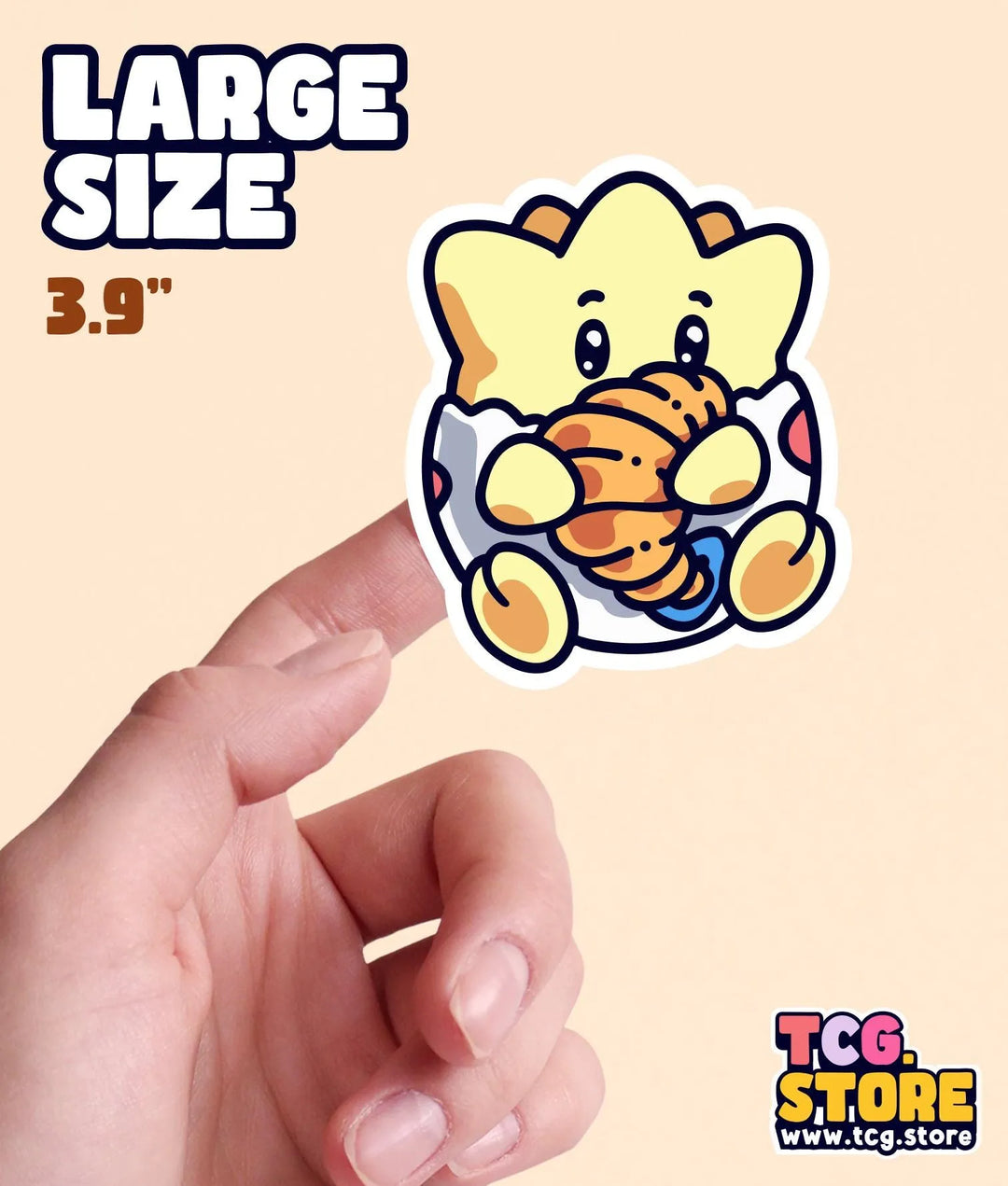 a hand holding a small sticker of an elephant
