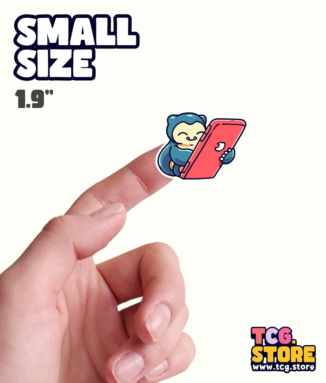 a hand is pointing at a small sticker