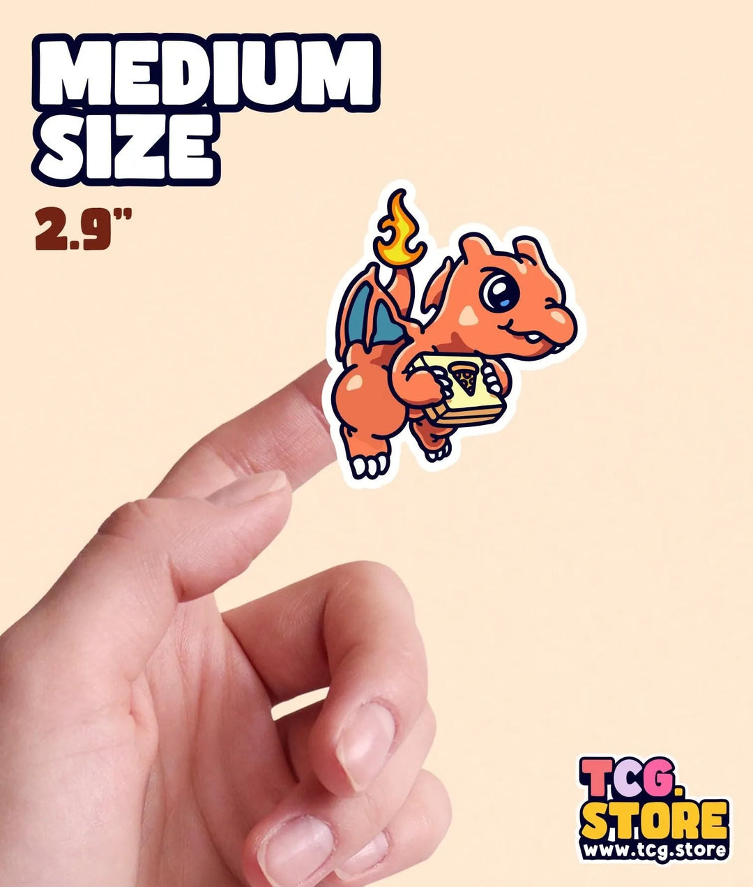 a hand holding a small sticker of a dragon