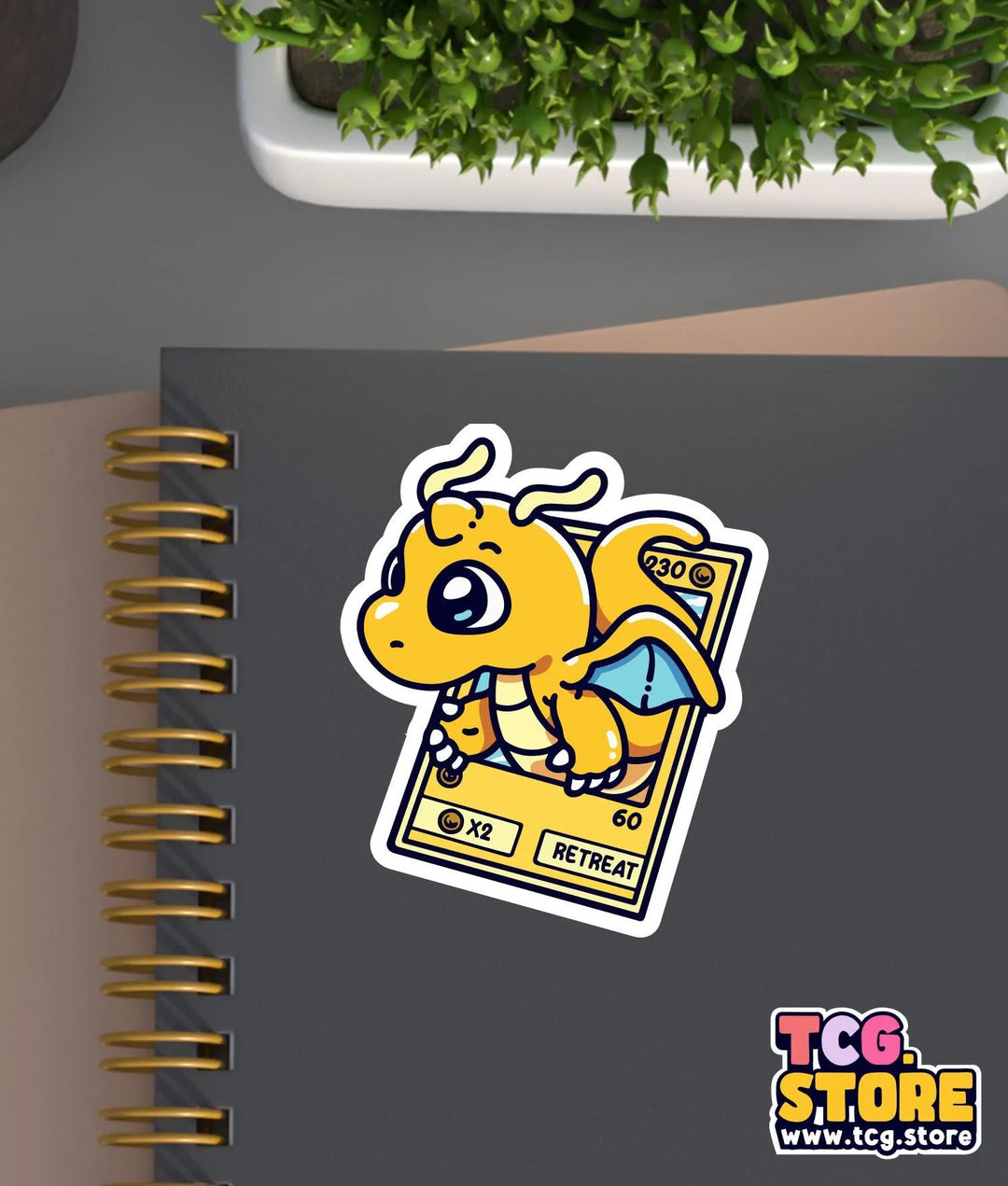 a notebook with a sticker of a dragon on it