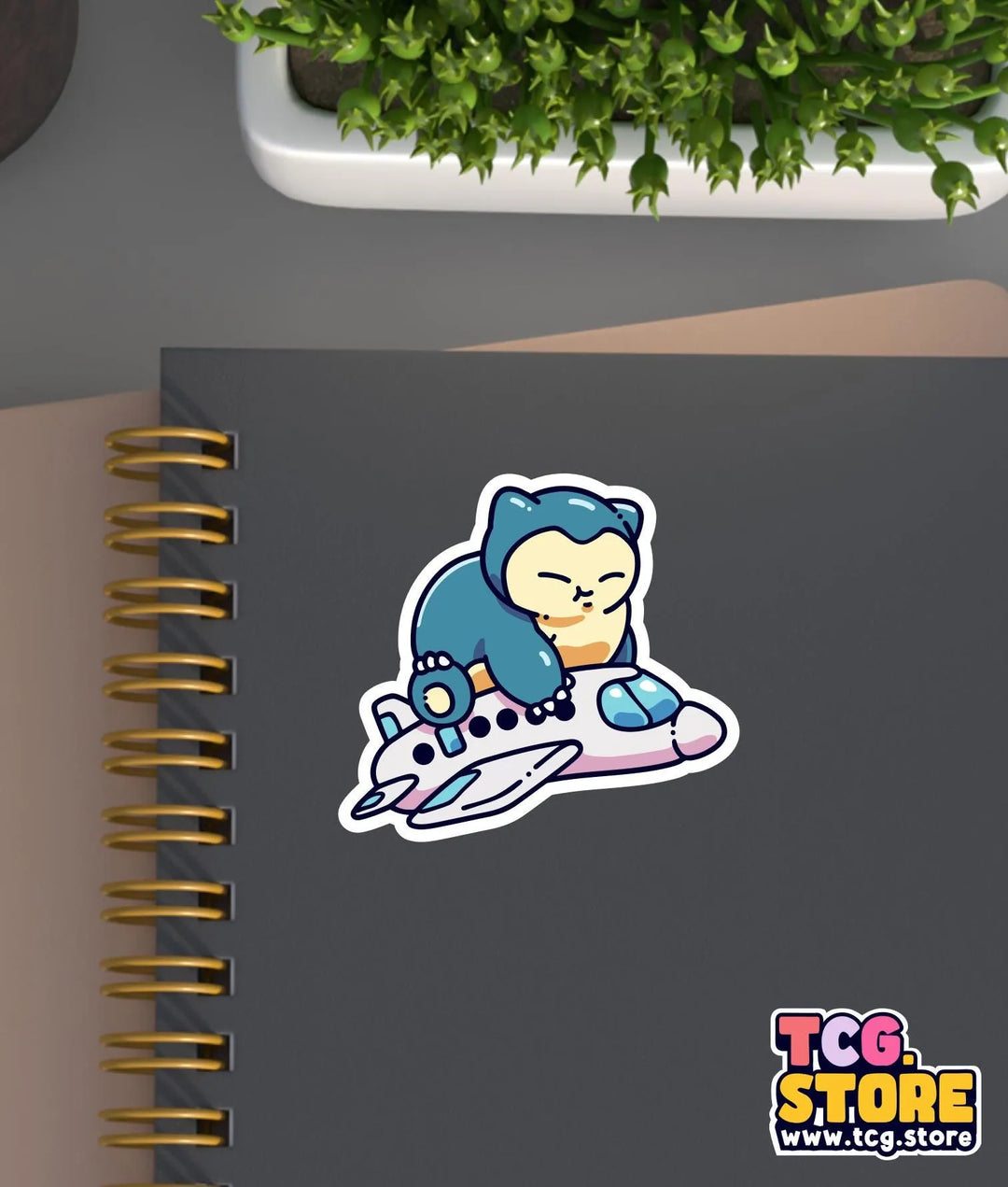 a notebook with a sticker of a cat on it