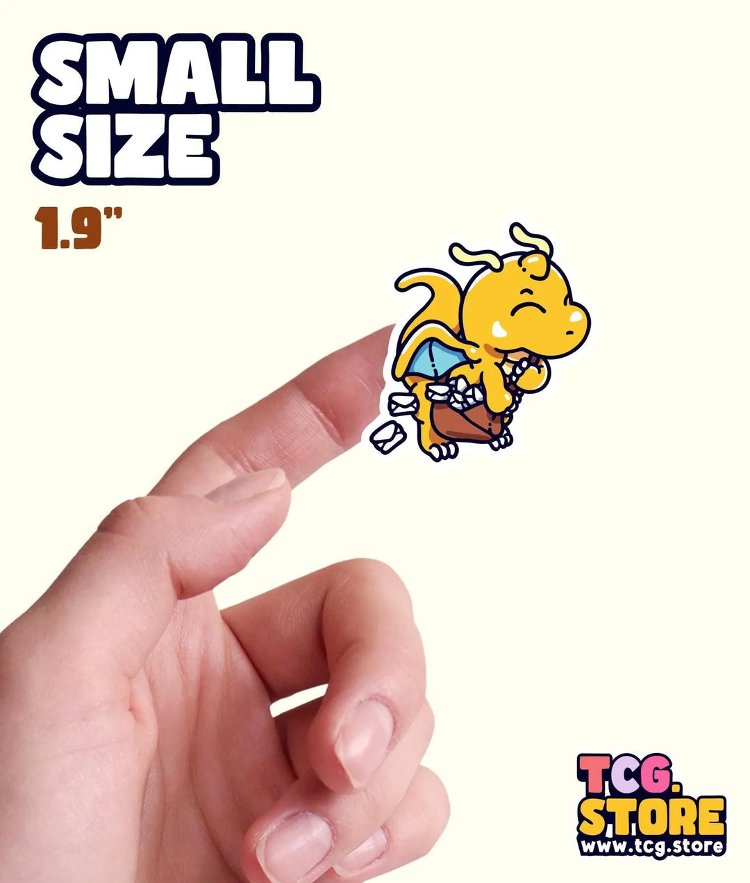 a hand is pointing at a small sticker