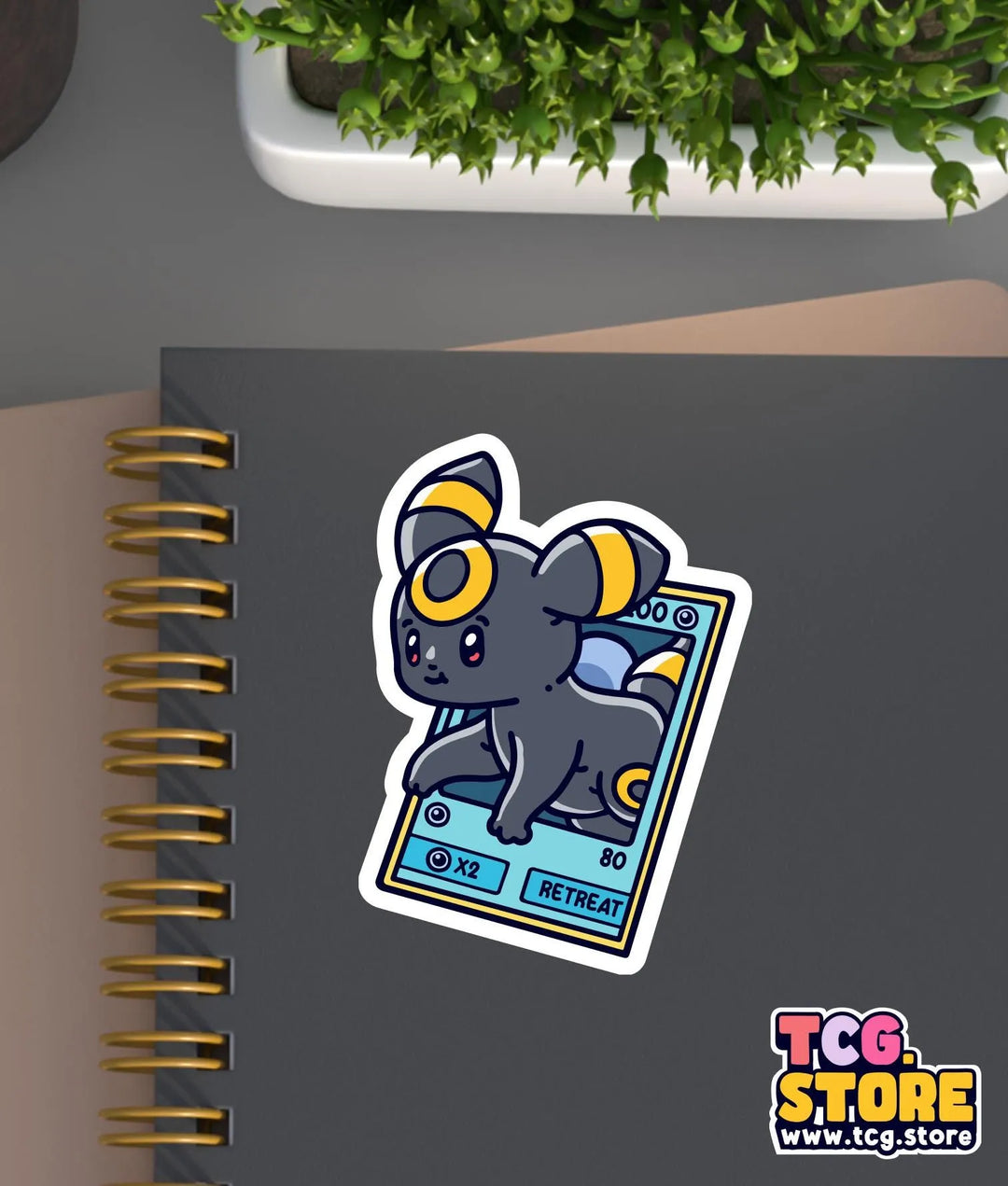 a notebook with a sticker of a mouse on it