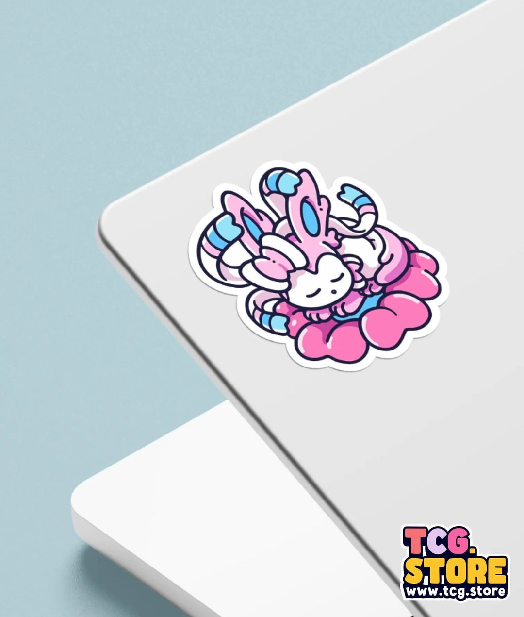 a sticker of a pink bunny sitting on top of a laptop