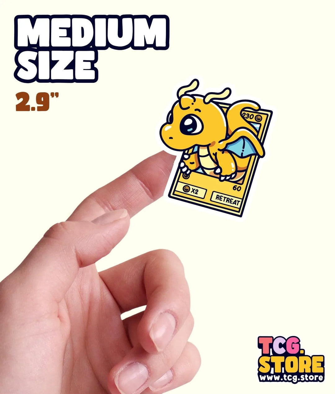 a hand holding a small yellow sticker