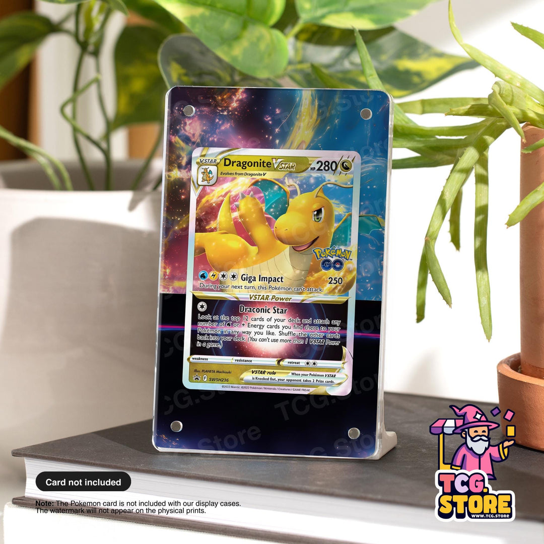 A dragon-themed Pokémon card is displayed on a stand, surrounded by plants and a potted plant.