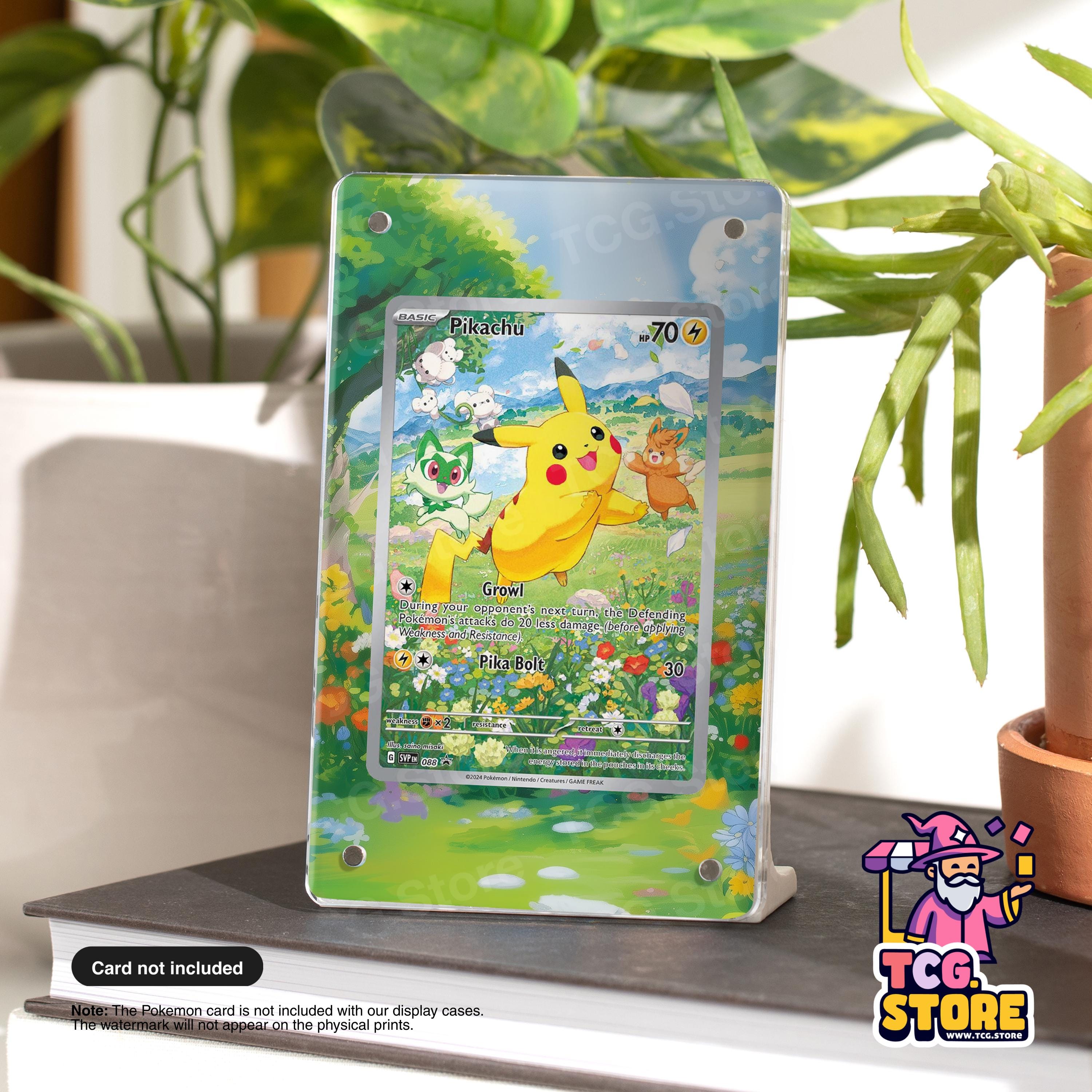 A Pokémon trading card featuring Pikachu, a popular Pokémon character, is displayed on a stand in front of a potted plant.