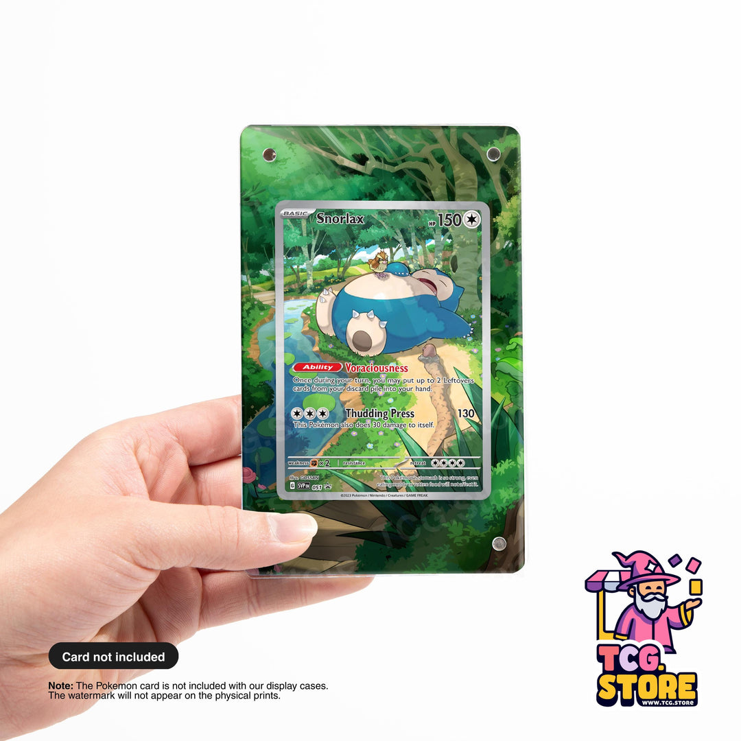 A hand holding a Pokémon trading card with a forest scene on the back.
