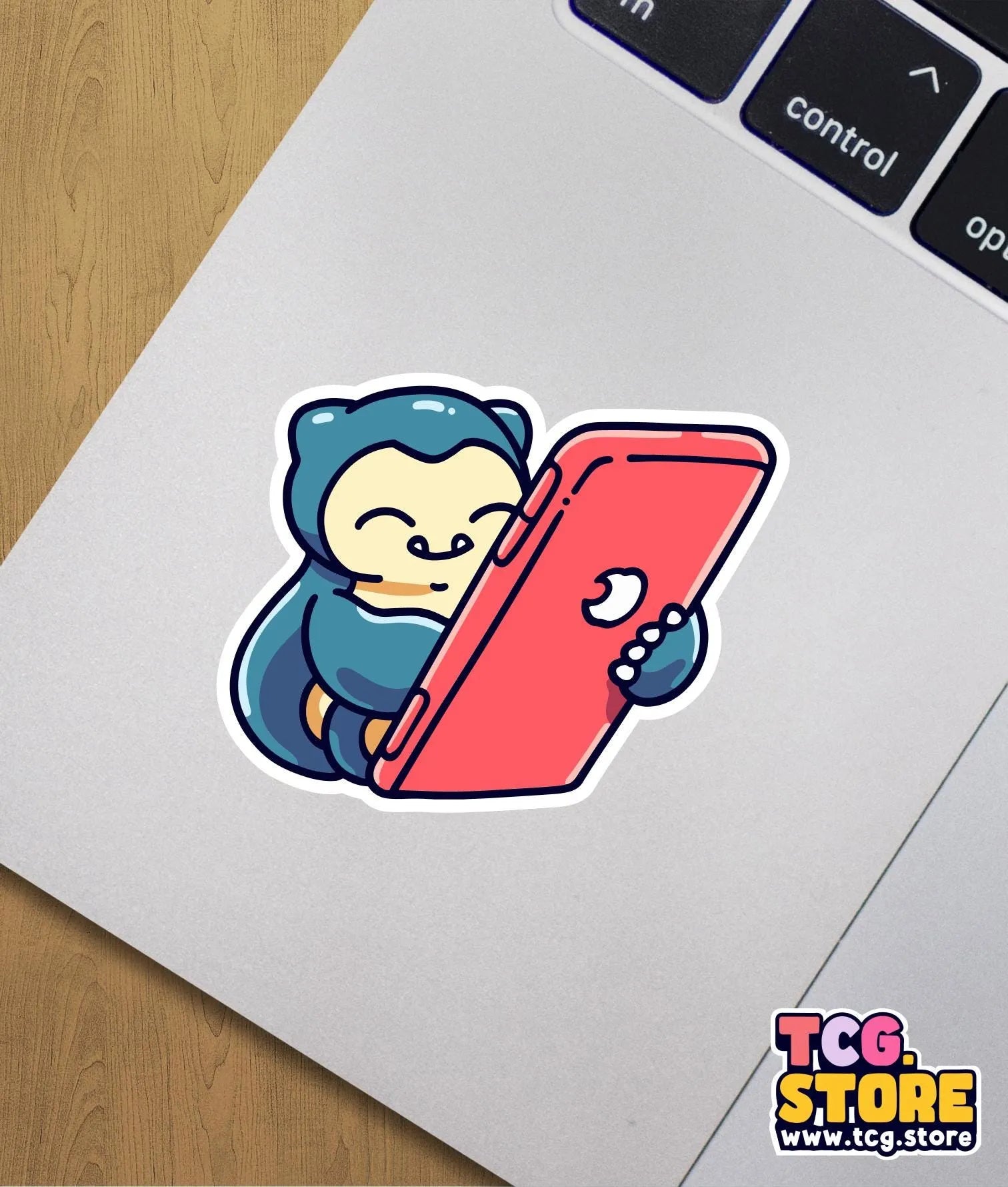 a sticker of a monkey holding a red object
