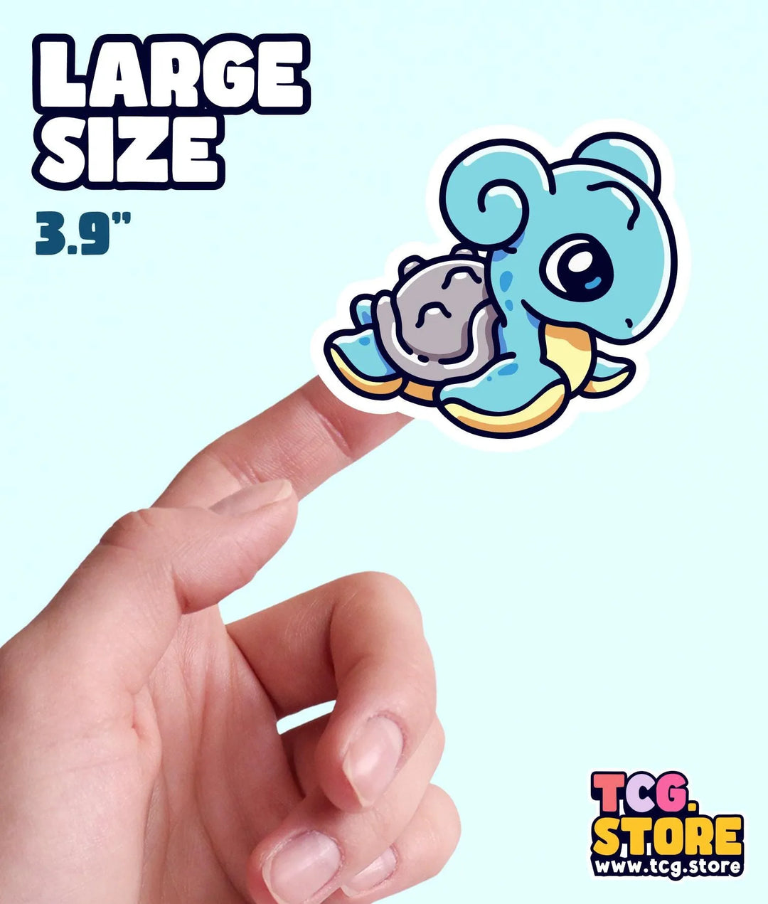 a hand holding a small sticker of a blue bear