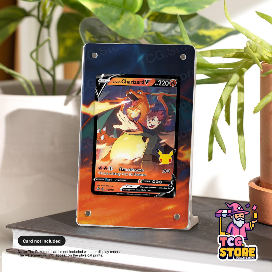 A Pokémon Charizard V card is displayed on a stand, with a plant in the background.