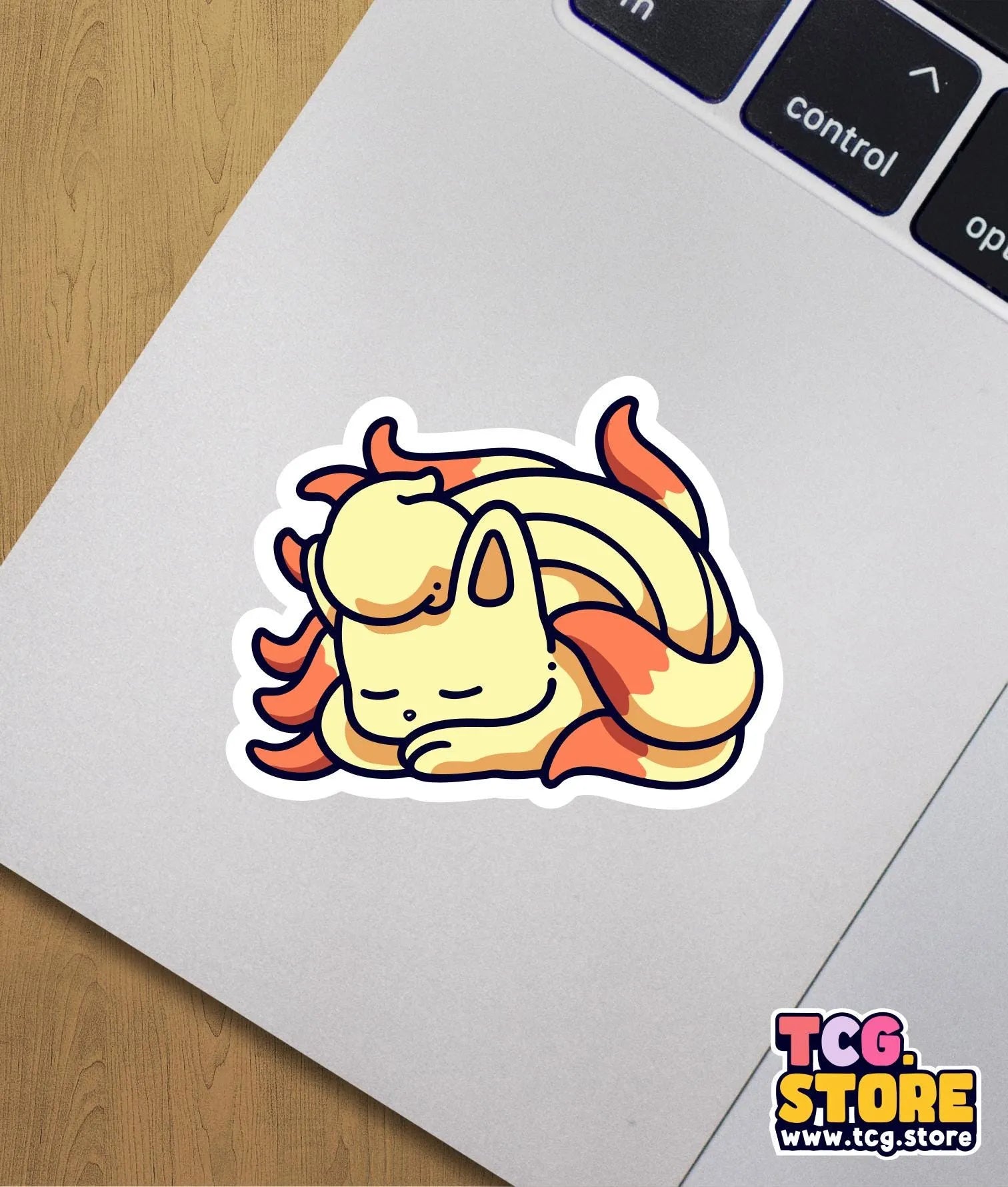 a sticker of a cat sleeping on a laptop