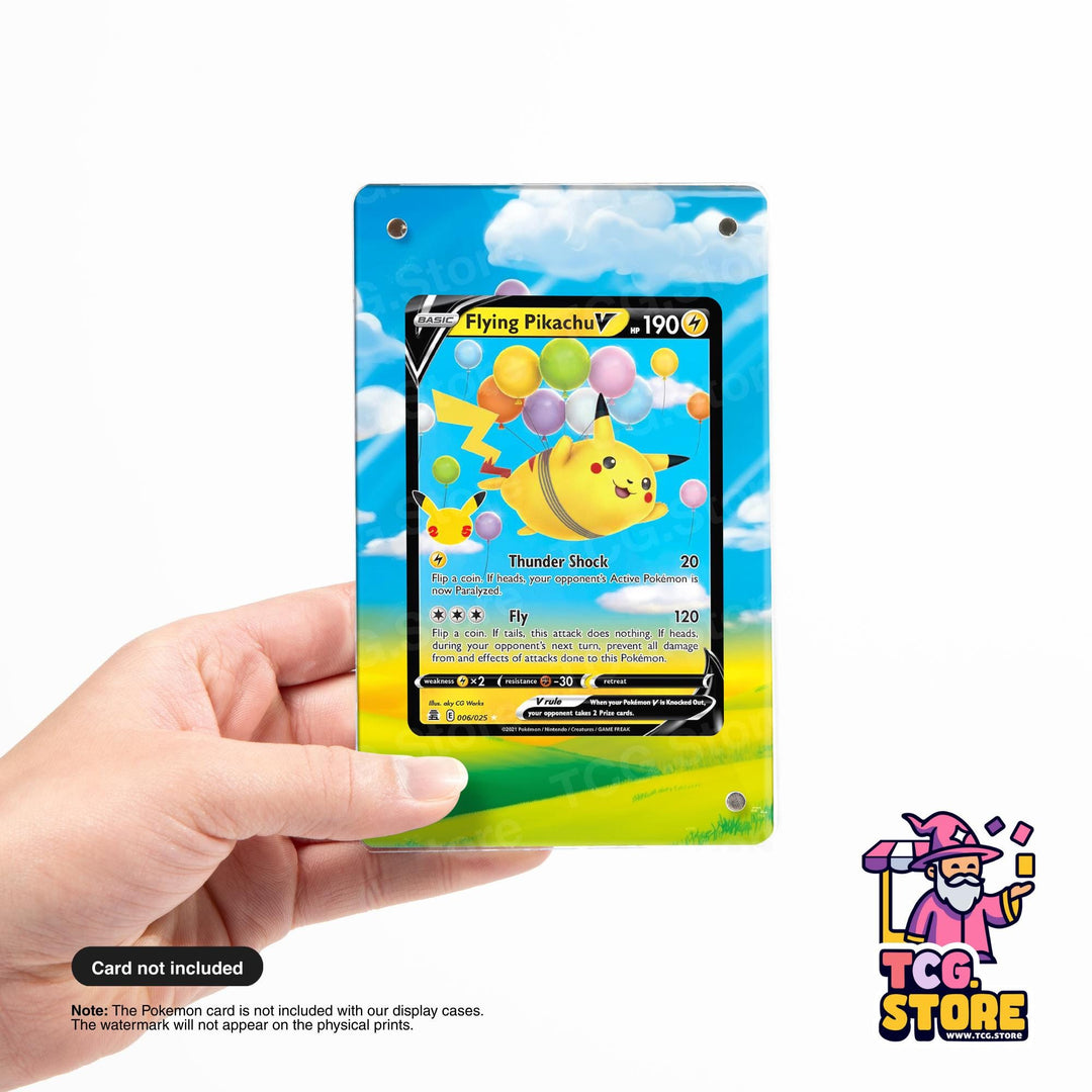 A hand holding a Pokémon card with a colorful, cartoonish design featuring Pikachu and balloons.