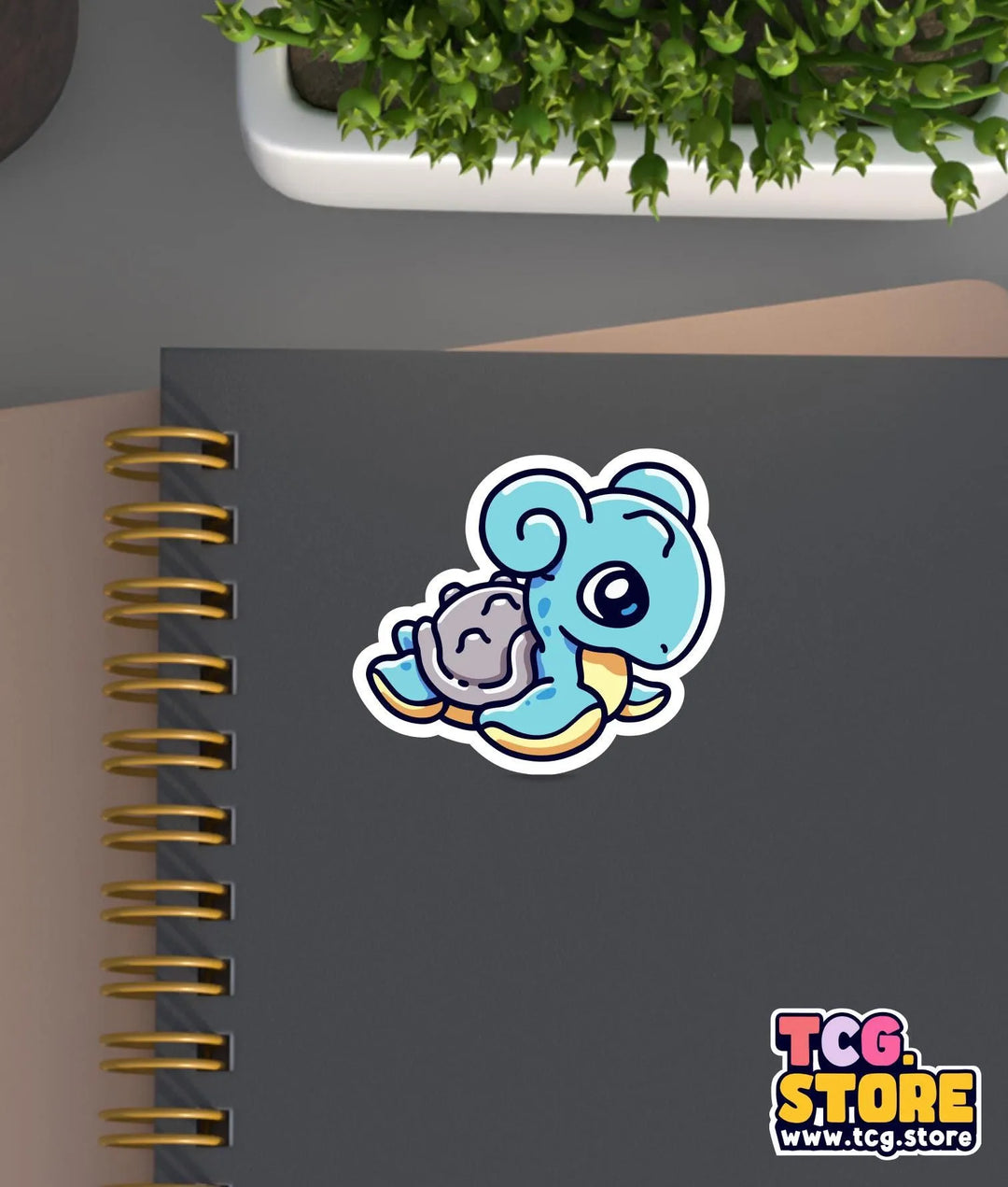a notebook with a sticker of an elephant