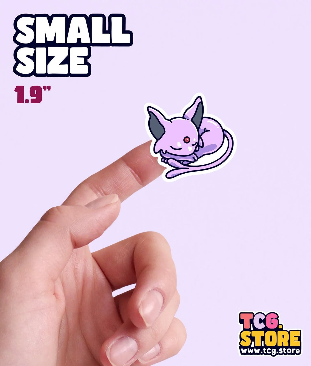 a hand is pointing at a small sticker