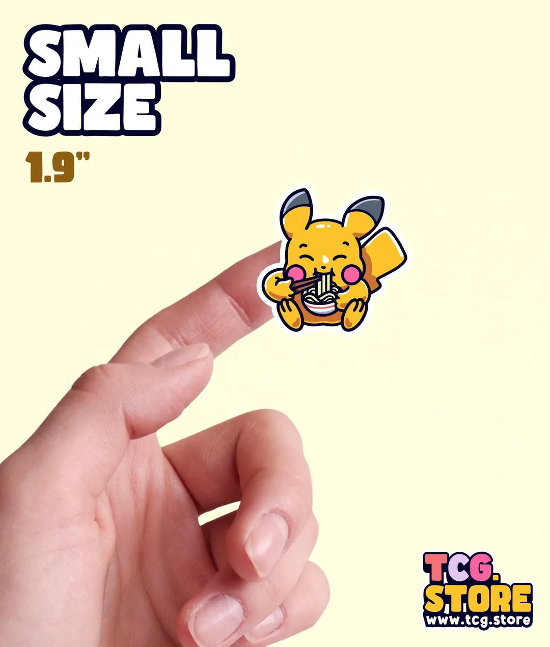 a hand is pointing at a small sticker